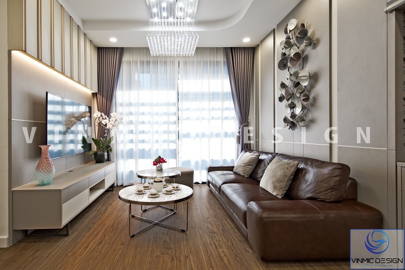 Bộ sofa da tone nâu cao cấp đơn giản góp phần tạo nên sự tinh tế cho phòng khách tại chung cư D’Capitale Trần Duy Hưng